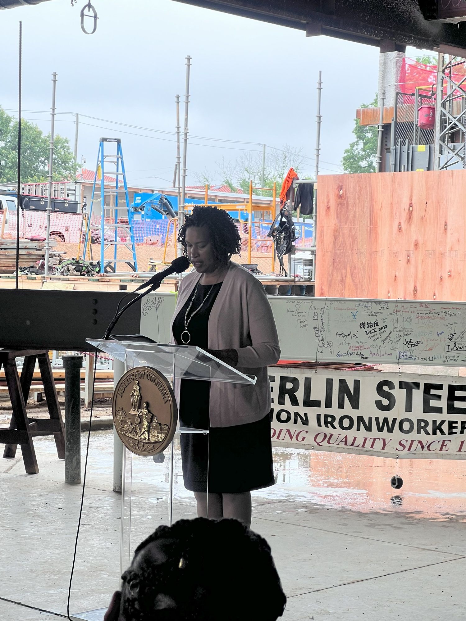 Topping out event with construction beam